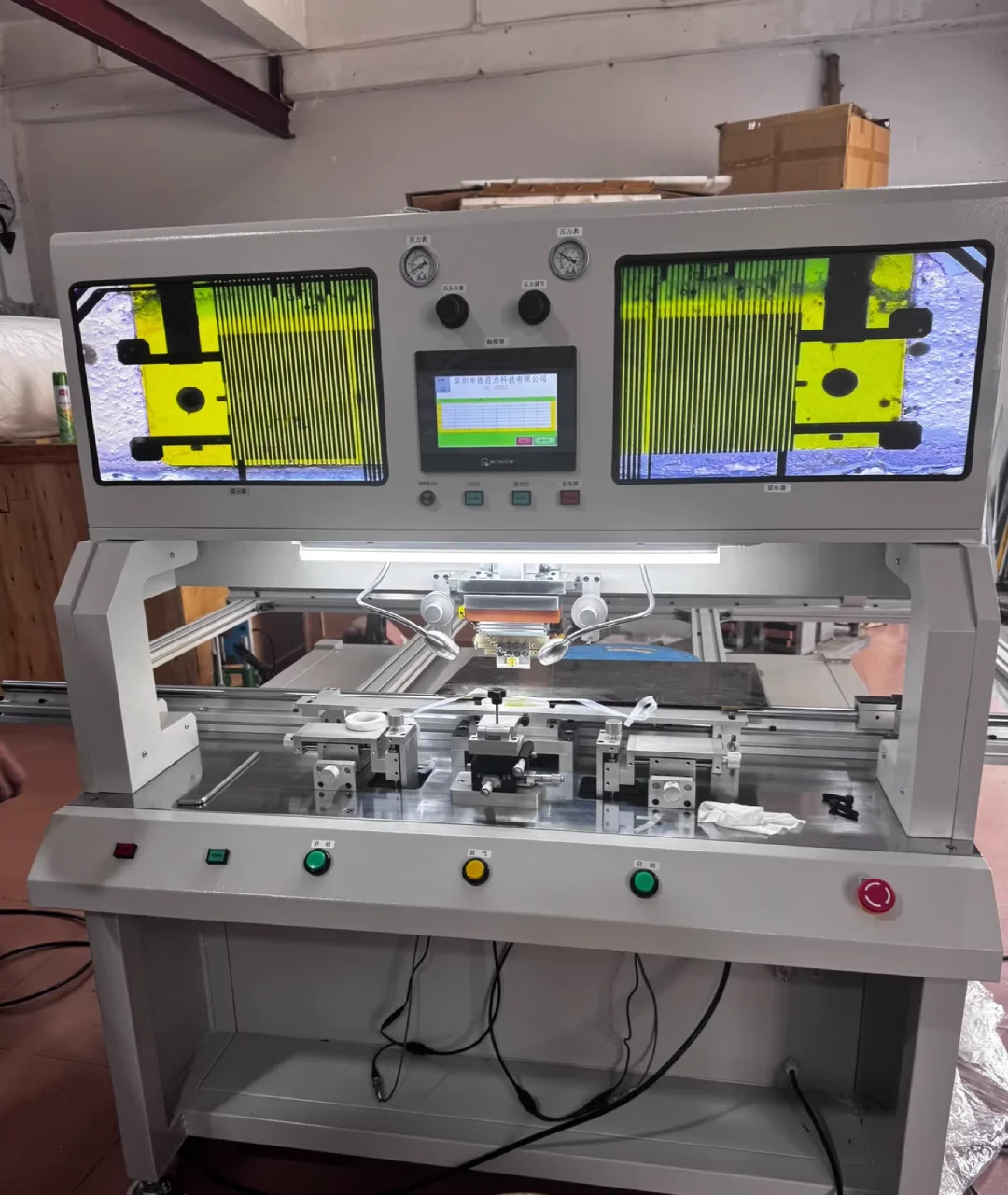A bonding machine for soft board(COF circuit on film), designed to fix the display issues of a LCD display.
